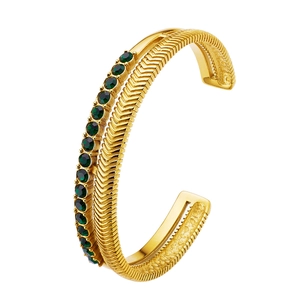 Gold double-layer open bangle featuring green zircon stones and vintage carved V-patterns
