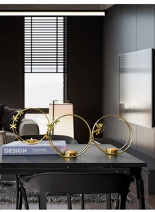 Close-up of golden iron angel and snowflake candle holders for modern interior decor