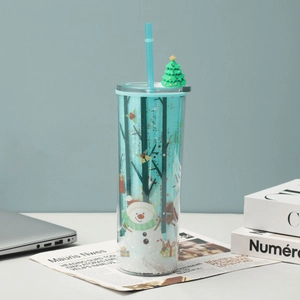 Detailed view of Christmas plastic straw cup with snowman, reindeer and glitter decorations