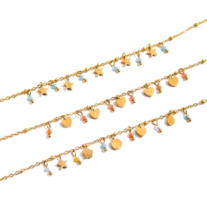Gold stainless steel chain necklaces with colorful heart and star charms on white background