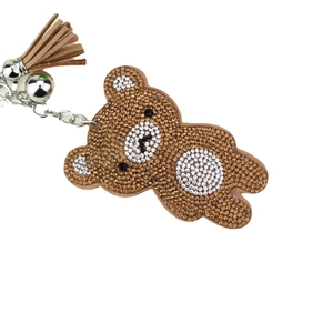 Cute brown bear keychain with sparkly rhinestones, silver bell and leather tassel detail