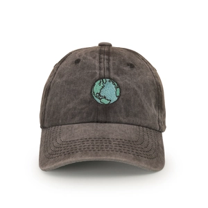 Close-up of earth embroidery detail on dark gray washed cotton baseball cap texture