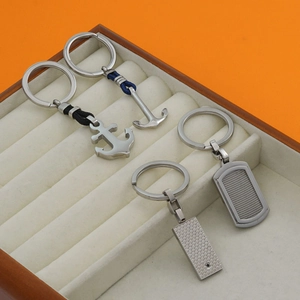 Set of stainless steel anchor and geometric textured keychains in premium gift display box