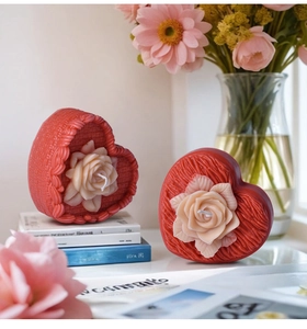 Detailed view of heart-shaped candle mold featuring intricate rose and woven texture