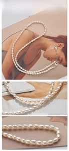 Macro detail of natural freshwater pearl necklace with floral charm and lobster clasp