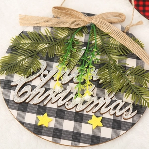 Close-up of rustic buffalo plaid wooden Christmas door sign with Merry Christmas text