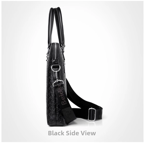 Detail view of black embossed briefcase side with silver metal zippers and nylon strap
