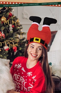 Funny Christmas elf leg hat in plush red fabric with black boots for festive party fun