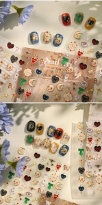 Detail of retro pop nail stickers with clock and heart designs on beige background