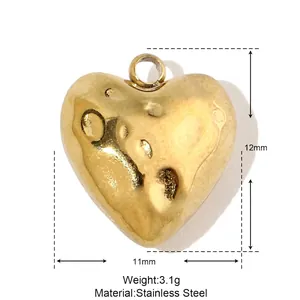 Macro detail of gold heart pendant with 11x12mm dimensions and 3.1g stainless steel weight