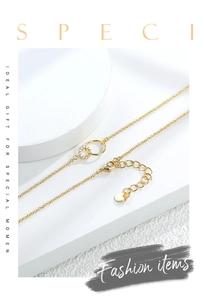 Detailed view of interlocking gold double ring pendant necklace with zircon pavé setting