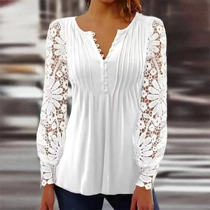 Close-up of white V-neck lace long sleeve top with button details and hollow-out texture