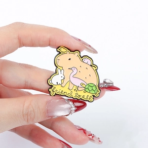 Cute Capybara cartoon enamel pin featuring friends and friend to all text