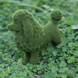 Detailed texture of green flocked poodle ornament for garden lawn and outdoor decoration