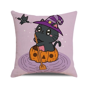 Close-up of Halloween linen pillowcase showing cute black cat in pumpkin and fabric texture