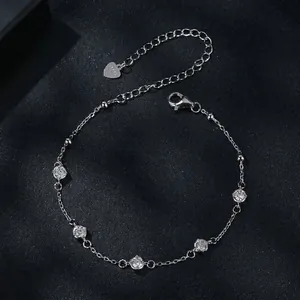 Elegant S925 sterling silver bracelet with five round clear moissanite stones on black background