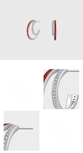Macro detail of S925 sterling silver C-hoop earring with red enamel and pavé zircons