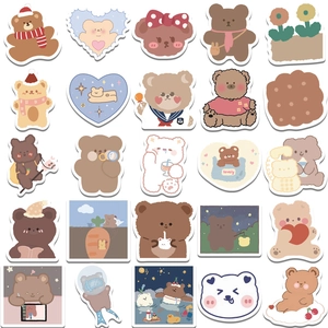 Close-up of waterproof cartoon bear stickers for decorating laptop and luggage