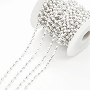 White pearl bead chain on spool for DIY jewelry making and clothing decoration