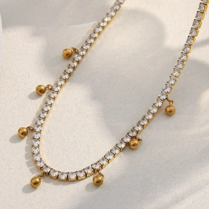 Elegant 18K gold-plated stainless steel tennis necklace with zircon beads and fringe tassels