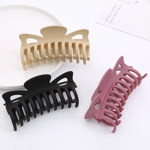 Detailed view of 12cm matte bow hair claws in beige, black, and pink purple colors