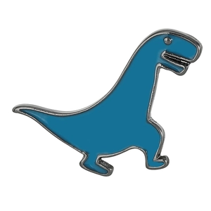 Close-up of a blue enamel dinosaur brooch with polished metal edges and smooth texture