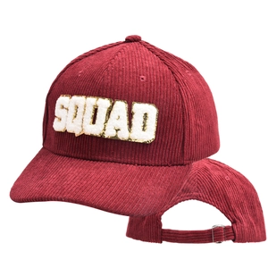 Detail of burgundy corduroy baseball cap showing SQUAD embroidery and metal buckle