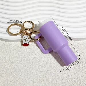 Purple mini tumbler keychain with Christmas boot charm showing dimensions 3.74x1.97 inches