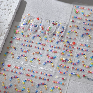Detailed relief flower nail art stickers with 3D daisies and floral wreaths for manicure