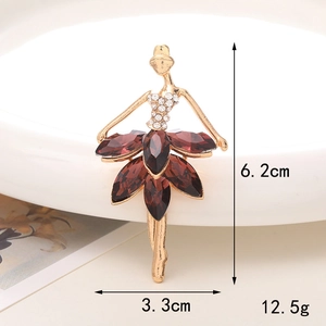 Detailed macro view of ballet dancer brooch with red gems and white rhinestones