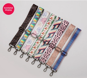 Adjustable crossbody bag straps with gunmetal hardware in eight decorative patterns