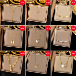 Collection of luxury titanium steel necklaces in gold and silver with elegant pendants