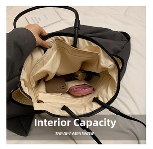 Interior view showing the large capacity with lining, zipper pocket, and card slots