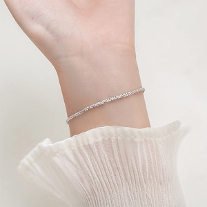 Elegant sparkling stainless steel chain bracelet for women in a bright silver finish