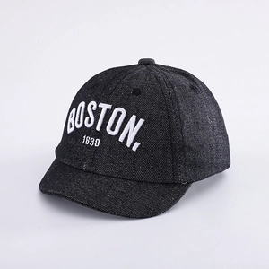 Detail of white Boston 1630 embroidery on dark denim short brim baby baseball cap