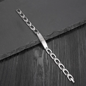 Punk style silver stainless steel chain bracelet with a polished blank ID plate