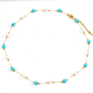 Elegant gold necklace with white pearls and turquoise stones on a clean white backdrop