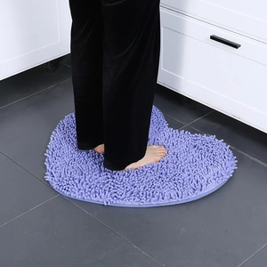 Plush purple heart-shaped chenille bath mat with non-slip backing for bathroom decor