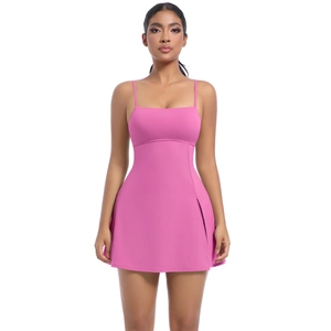 Detail view of the rose pink sports dress showing side slit and slim strap design