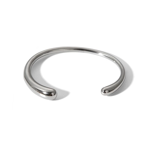 Detailed view of polished silver stainless steel open bangle with rounded ends