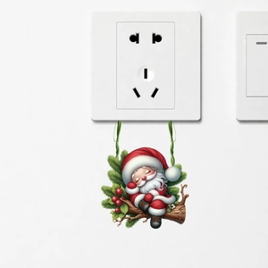 Detail of Christmas wall sticker showing Santa Claus sleeping under a power socket