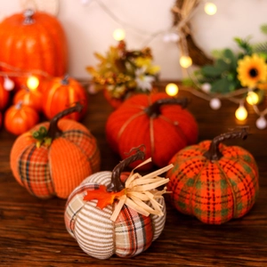 Assorted fabric pumpkins with autumn patterns for Harvest festival table decor