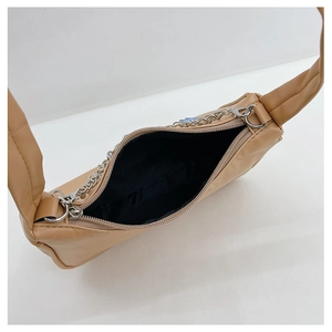 Top view of beige PU leather shoulder bag showing zipper closure and chain detail