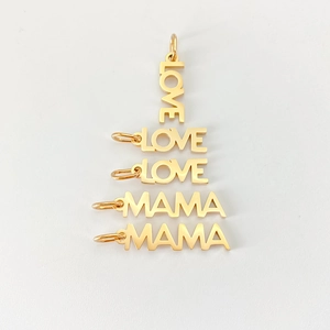 Detailed view of gold-plated LOVE and MAMA letter pendants for DIY jewelry making