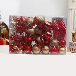 Christmas tree ornaments set with red and gold balls and star in gift box packaging