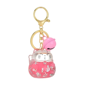 Japanese Lucky Cat liquid quicksand keychain with pink sequins in a clear acrylic pendant