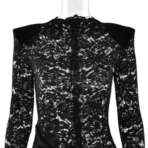 Detail of black lace dress with padded shoulders and elegant side draping fabric