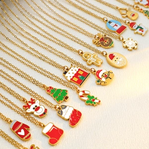 Set of 12 Christmas necklaces with enamel pendants featuring Santa, reindeer and snowman