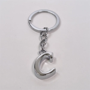 Polished silver alloy letter C keychain with a round ring and short chain on white background
