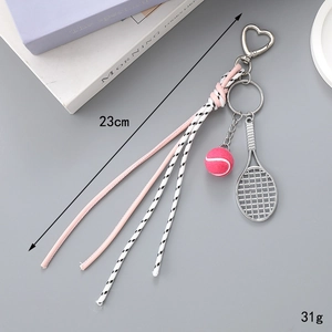 Chic leather cord keychain with tennis racket and pink ball pendant on grey background